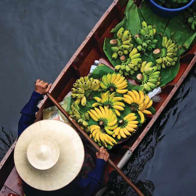 Person on boat selling bananas