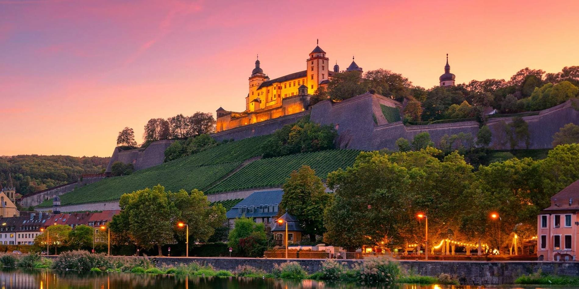 High on the hill at sunset, sits Marienberg Fortress in Wurzburg